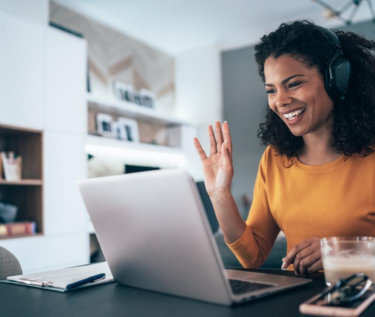 Woman greeting others on a video call