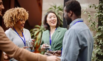 Group of people talking at a networking event