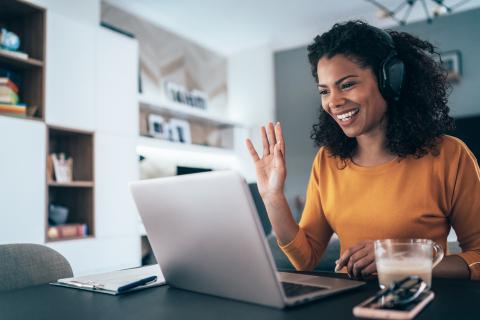 Woman greeting others on a video call