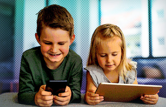 Photo of a boy and a girl using a tablet and a mobile phone